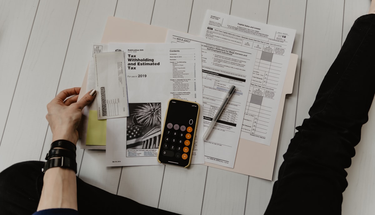 Calculator and financial documents for debt planning